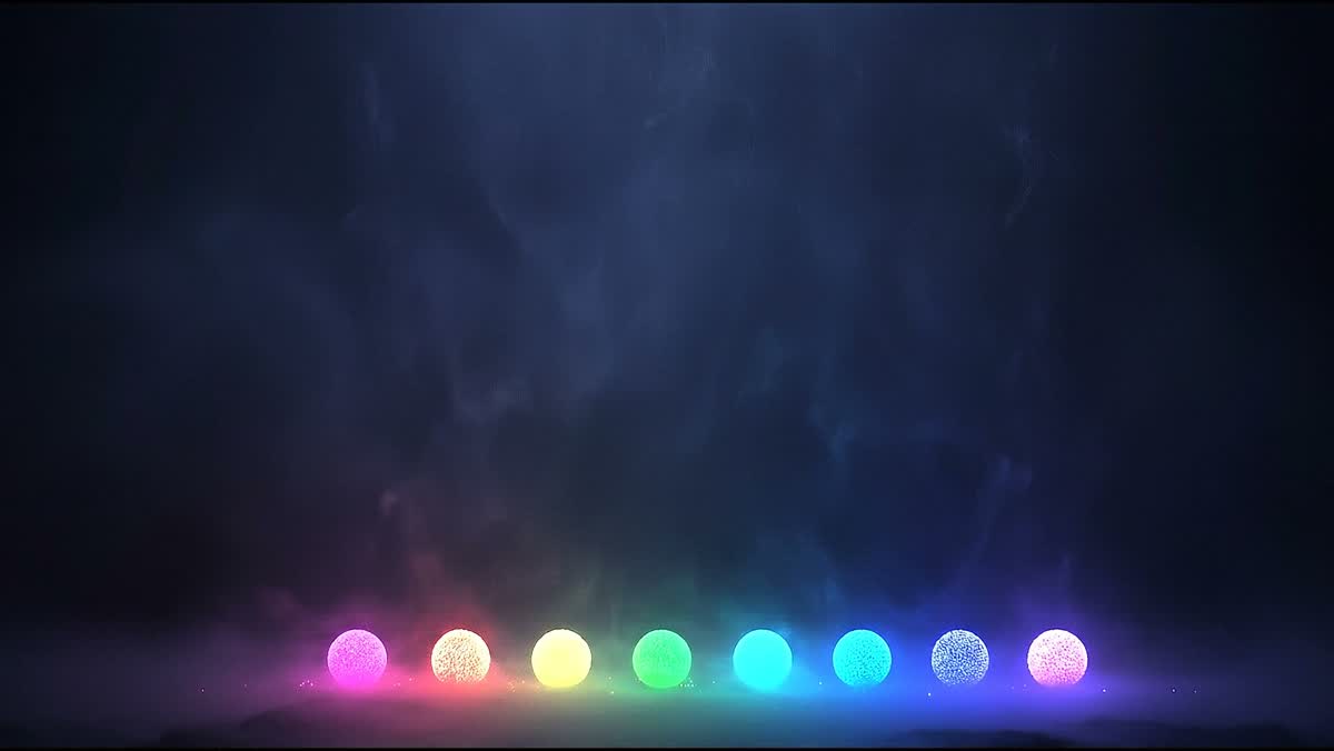 Particle rain: colored motes settling into glowing orbs